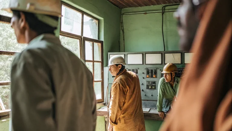 Power system operators coordinating grid restoration in a control room